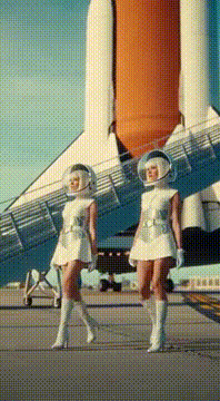 AI generated video: Two women in André Courrèges' modern 1969 Couture Future board the space…