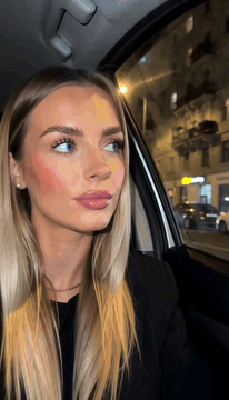 AI generated video: summary: A 12-second live-action night clip in a car driving through a city…