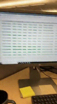 AI generated video: In the office at computer, the camera turns away from the computer monitor in…