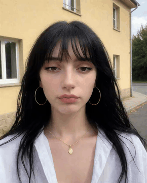AI generated video: Same person, same outfit, same plain background. Head and shoulders, face large…