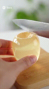 AI generated video: A popular ASMR video of cutting transparent apple. The screen is just cutting…