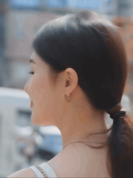 AI generated video: A sweet 21-year-old girl, with her back to the camera, turns her head and makes…
