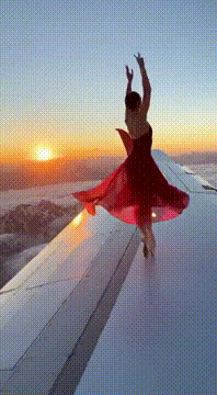 Видео, сгенерированное нейросетью: Up here, where the world is quiet and the sun kisses the wing… she becomes…