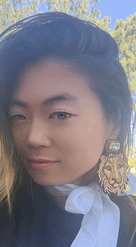 AI generated video: With an increasingly large smile, subject winks one eye, as the camera very…