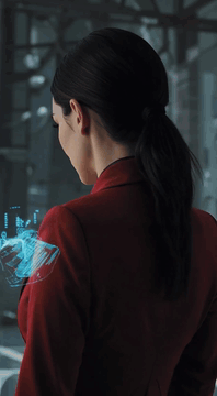 AI generated video: Style: futuristic, cinematic. A woman slowly turns her head as a holographic…