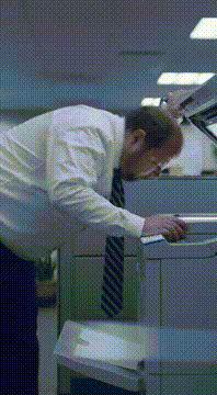 AI generated video: Middle aged out of shape Office worker is photocopying his face, the image that…