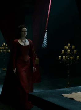 AI generated video: Tracking medium shot inside a dark, opulent temple where red velvet curtains…
