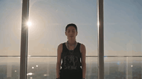 AI generated video: Medium shot of an attractive Asian woman with an alt punk style wearing a black…
