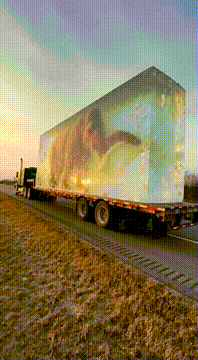 AI generated video: Giant ice block carrying a woolly mammoth melts on the highway. Nature's…