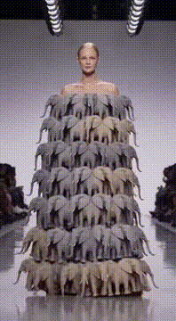 AI generated video: A high-fashion runway moment at an exclusive Chanel fashion show. A young…