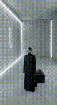 AI generated video: surreal monochrome film where the interior of the minimalist space flips…