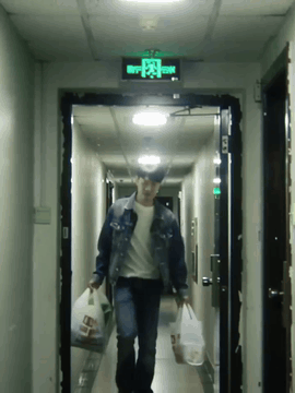 AI generated video: A realistic candid video of a man walking confidently through an apartment…