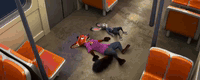 AI generated video: z00t0p1a, Nick Wilde, Judy Hopps. A high-angle wide shot of a red 3D rendered…