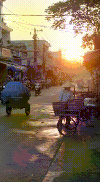 AI generated video: “A cinematic 10-second continuation showing Vietnamese street vendors in the…