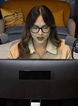 AI generated video: A woman is using a computer. She is facing us. "You see, they added a new…