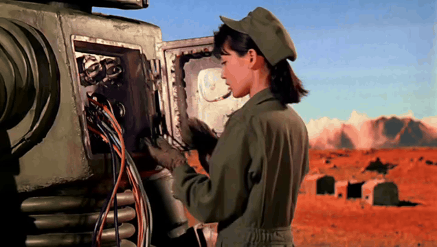 AI generated video: integrated_multimodal_description: 50s_scifi, a young asian woman is repairing…