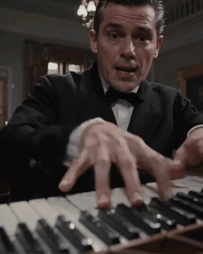 AI generated video: A breathtaking cinematic close-up shot of a manic 40 years old pianist's hands…