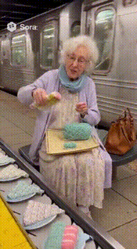 AI generated video: A sweet grandma lays her knitting onto a moving subway platform like it’s a…