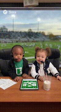 AI generated video: Talking baby sports casters discuss the tush push at a football game.