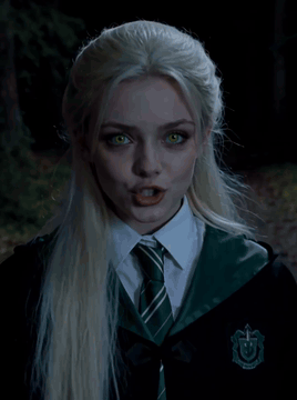 AI generated video: Night. felt_stopmotion_style. Out in the woods. <Subject 1> She smirks and…