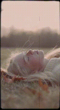 AI generated video: Four cuts in this video from different angles. A young blonde woman with…