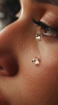 AI generated video: Tears with legs and eyes running down her cheeks