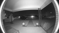 AI generated video: ring cam ,night time , man in banna suit run pass the , he scream im im comeing…