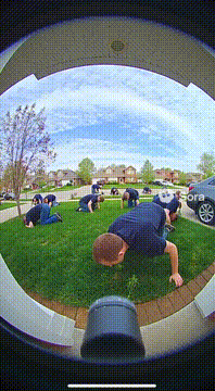 AI generated video: Hyperrealistic video from a ring camera showing 100 @joshuapie eating grass…