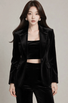 AI generated video: A woman in a black blouse stands still and looks at the front, her long hair…