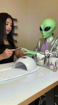 AI generated video: @marissalasnier as a nail technician doing an alien lady nails