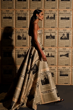 AI generated video: A high-fashion, elegant woman wearing a hi-tech electronic newspaper gown as…