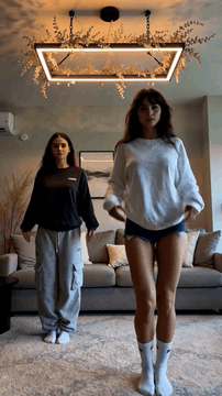 AI generated video: Laura and her friend dance