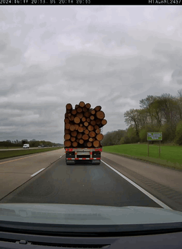AI generated video: First-person dashcam footage from inside a car on a two-lane highway on an…