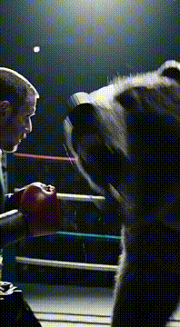 AI generated video: A hyper-realistic @koolk1979 in boxing shorts and gloves stands defiantly in a…