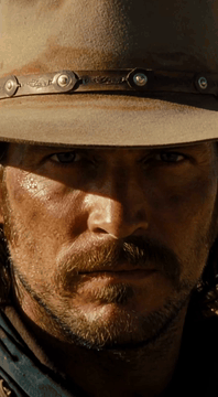 AI generated video: Extreme cinematic close-up on a hardened gunslinger’s eyes shadowed beneath the…