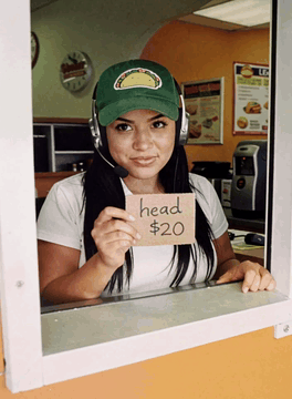 AI generated video: A pretty woman behind the drive through window at a fast food restaurant. The…