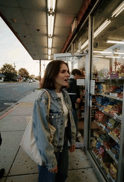 AI generated video: An unedited handheld phone recording of a young woman in her early twenties…