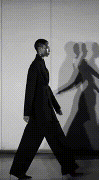 AI generated video: surreal avant-garde black and white fashion film where the model moves slowly…