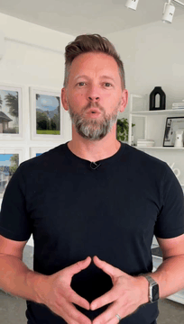 AI generated video: professional presenter in a modern white-walled office setting, framed in a…